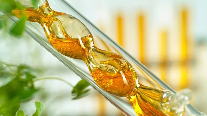 Golden bioactive serum in glass laboratory tube
